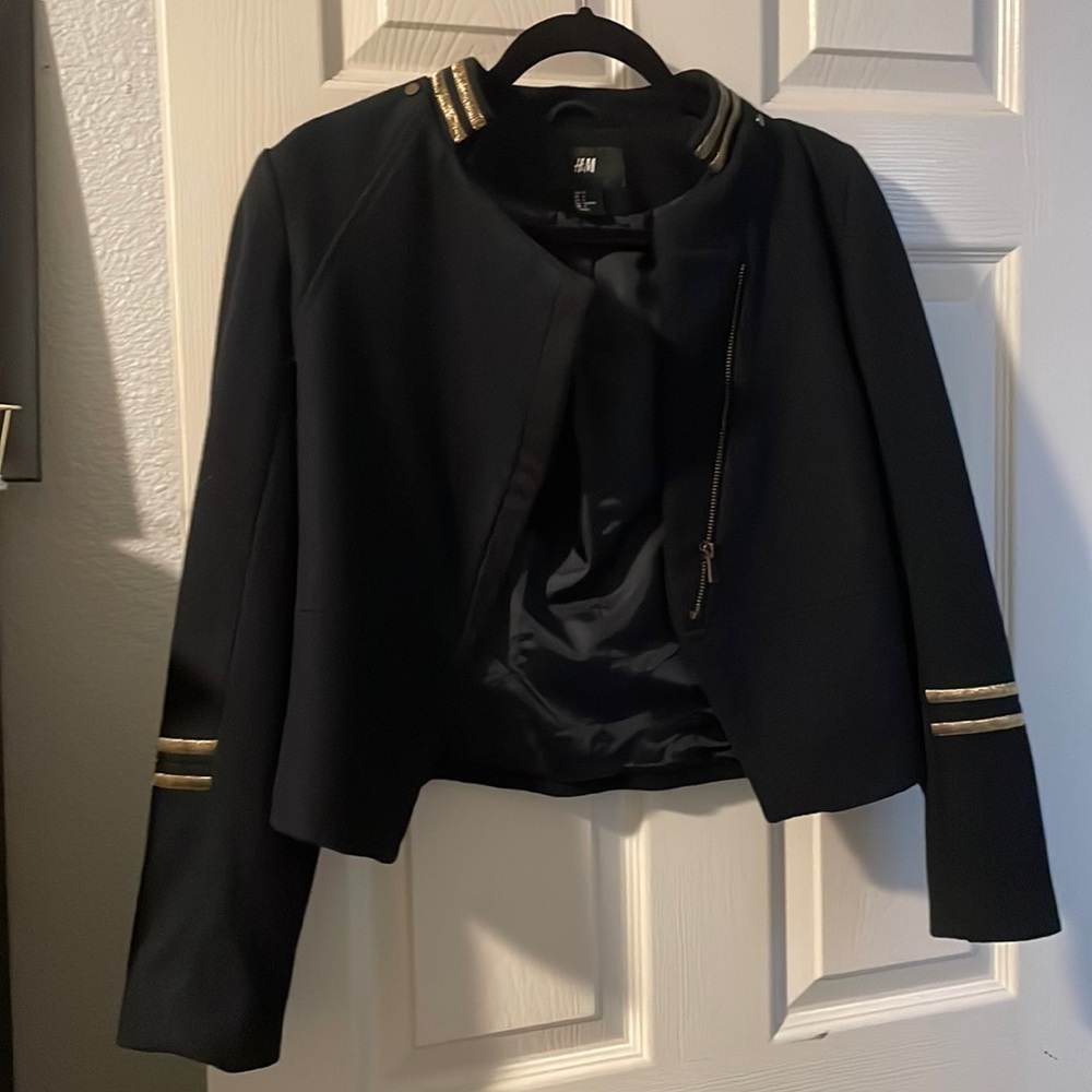 Blue jacket with gold and it fit more like a XS to S